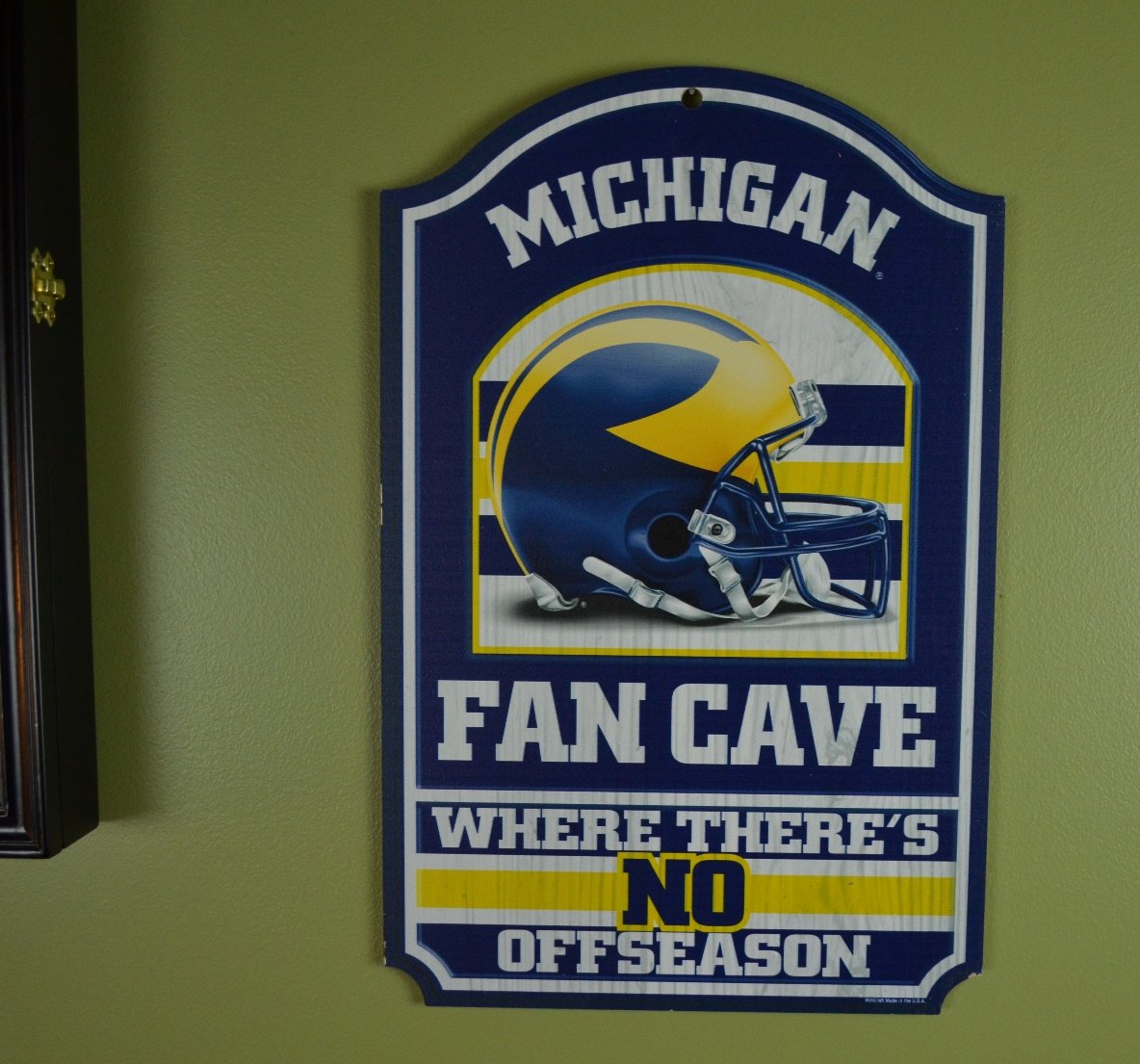 WinCraft Collegiate Fan Shop Authentic NCAA Fan Cave Wooden Sign. Stake Your Territory with This Sign. For the Office or Man Cave. This 11"X17" Sign Let's Everyone Know Your Team