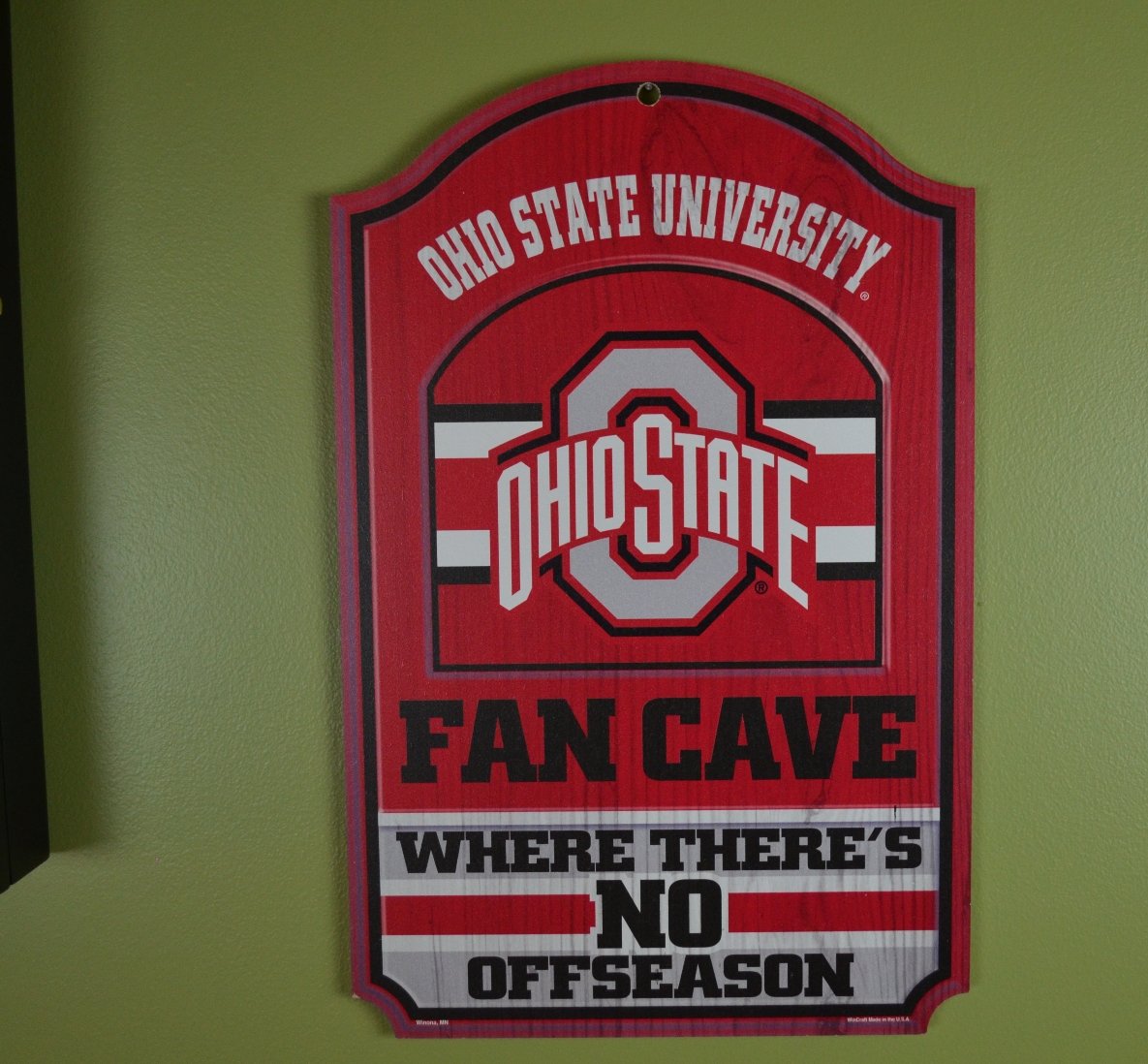 WinCraft Collegiate Fan Shop Authentic NCAA Fan Cave Wooden Sign. Stake Your Territory with This Sign. For the Office or Man Cave. This 11"X17" Sign Let's Everyone Know Your Team