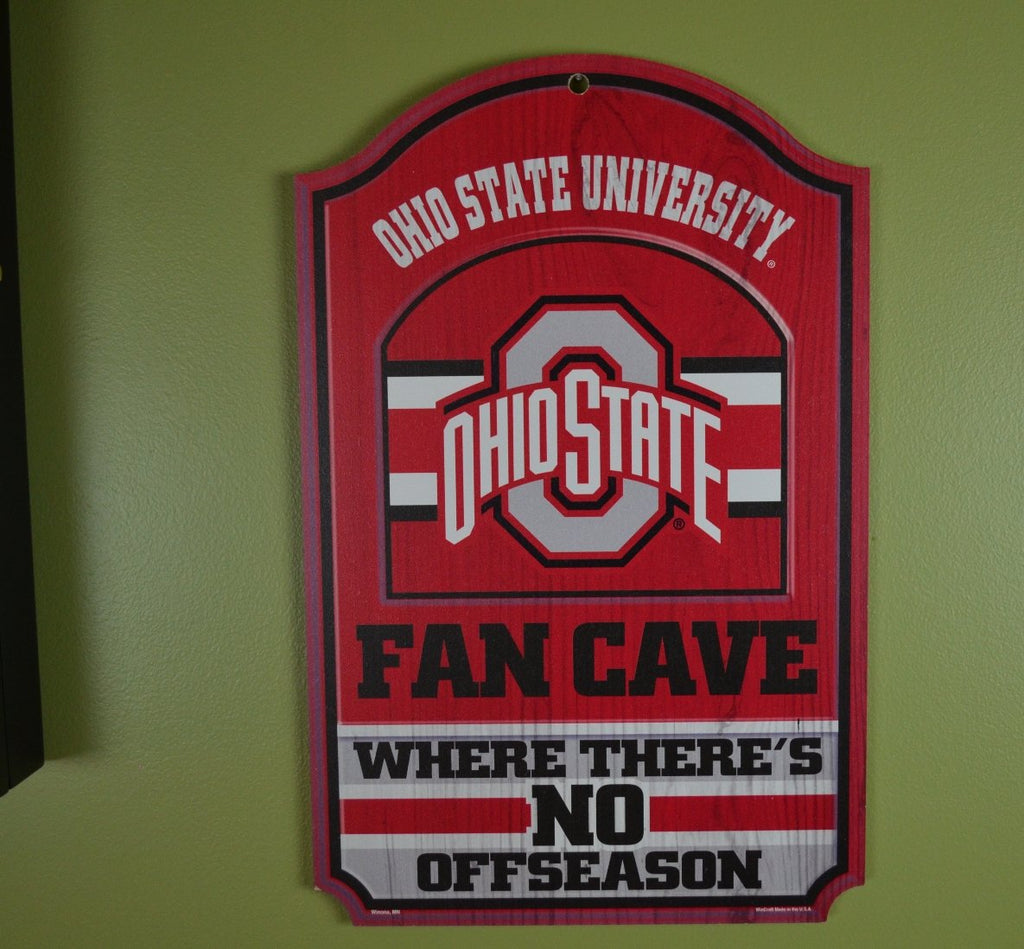 WinCraft Collegiate Fan Shop Authentic NCAA Fan Cave Wooden Sign. Stake Your Territory with This Sign. For the Office or Man Cave. This 11"X17" Sign Let's Everyone Know Your Team